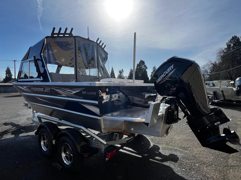 Slide: The Image of 2024 Thunder Jet 185 Luxor boat with Mercury outboard motor on a trailer. - 3