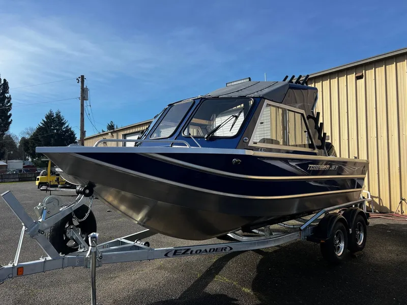 Slide: The Image of 2024 Thunder Jet 185 Luxor boat on EZ Loader trailer, parked outdoors. - 5