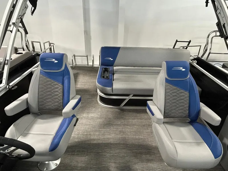 Slide: The Image of 2024 Bennington 22SSB boat interior with blue and gray seating. - 11