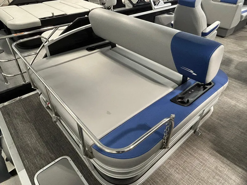 Slide: The Image of 2024 Bennington 22SSB boat seating area with blue and gray upholstery. - 13