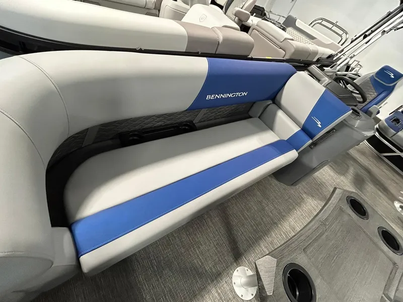 Slide: The Image of 2024 Bennington 22SSB boat interior with blue and gray seating. - 4