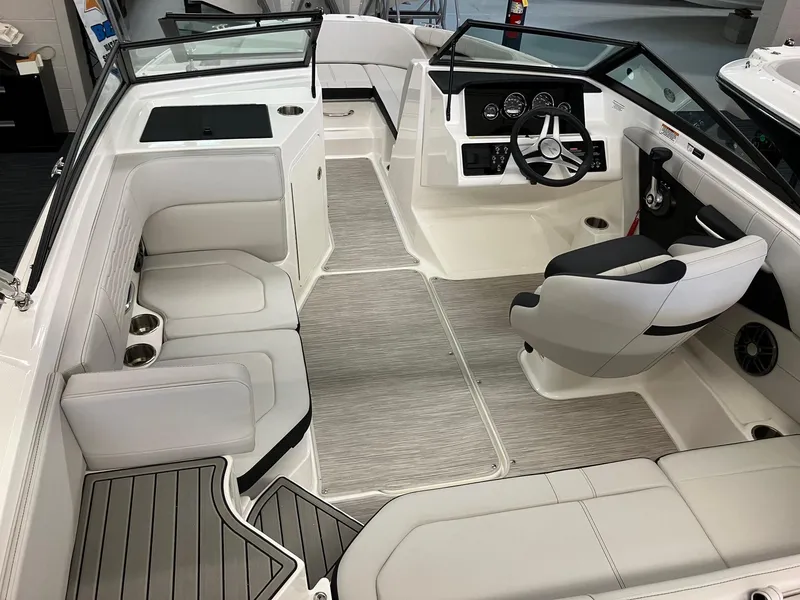 Slide: The Image of 2024 Sea Ray SPX 190 boat interior with white seating and modern dashboard. - 4