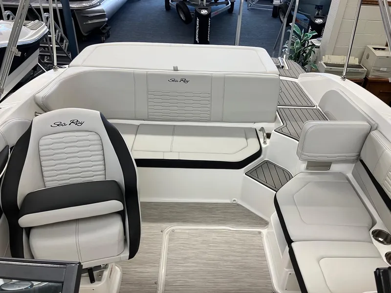 Slide: The Image of 2024 Sea Ray SPX 190 boat interior with white and black seating. - 5