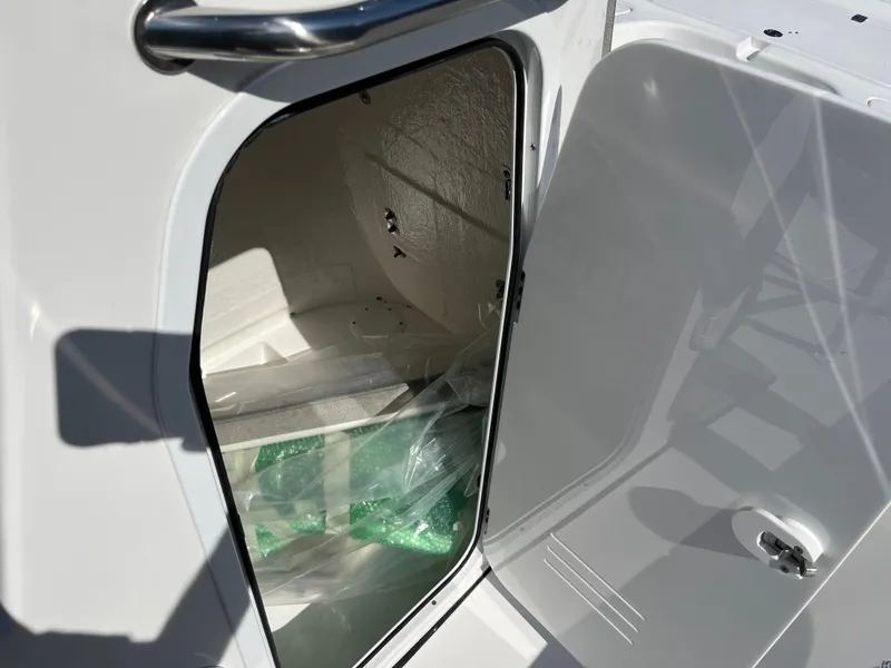 Slide: The Image of Open storage compartment on a 2024 Sea Pro 230 Bay boat. - 15