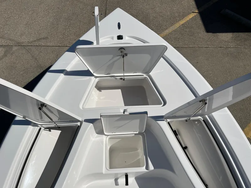 Slide: The Image of 2024 Sea Pro 230 Bay boat with open storage compartments. - 35