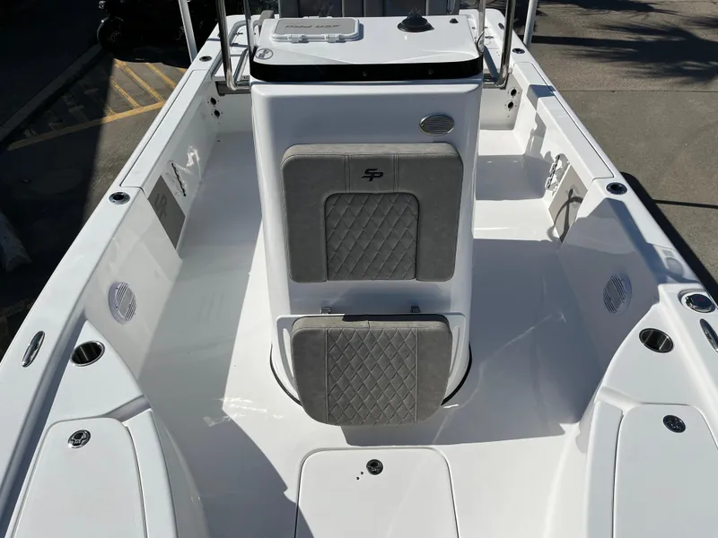Slide: The Image of 2024 Sea Pro 230 Bay boat interior with cushioned seating and console. - 37
