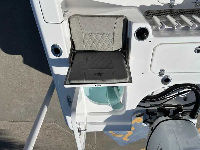 Slide: The Image of 2024 Sea Pro 230 Bay boat with cushioned seating and storage compartment. - 45