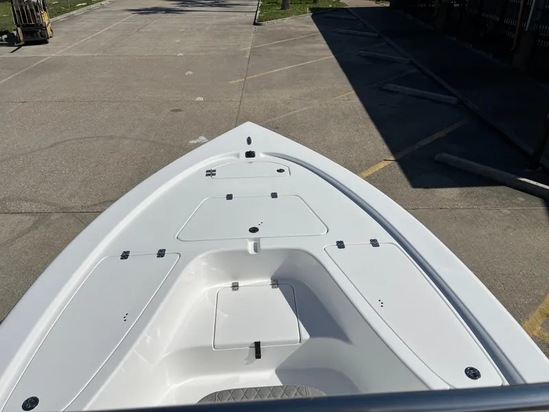 Slide: The Image of 2024 Sea Pro 230 Bay boat bow view in a parking lot. - 9
