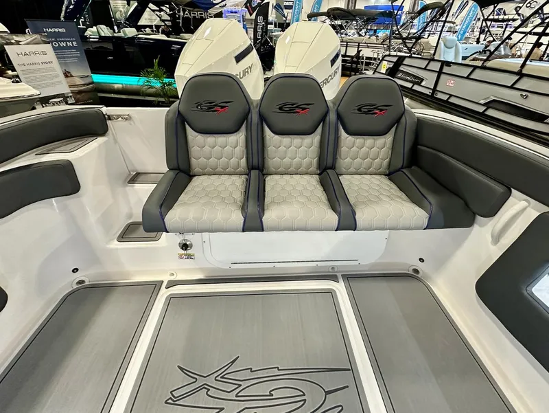Slide: The Image of 2024 Glasstream 32 GSX boat interior with triple seats and Mercury engines. - 16