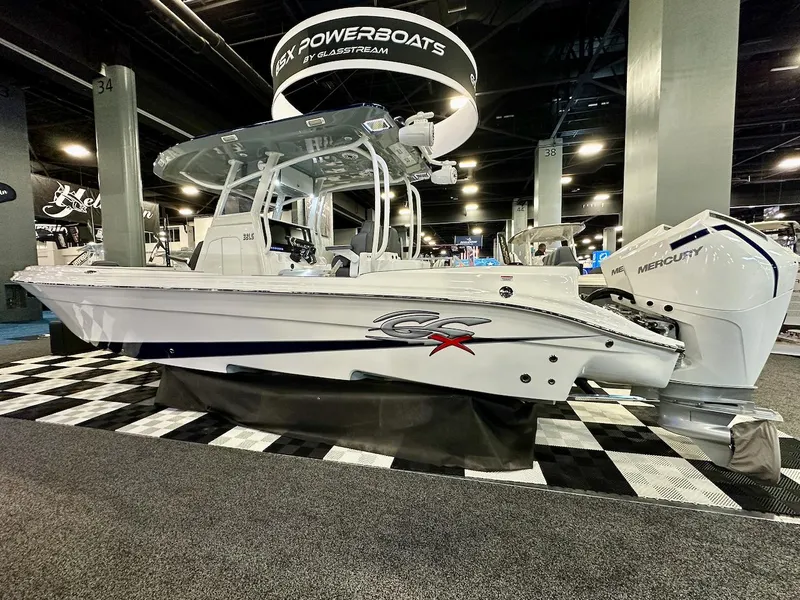 Slide: The Image of 2024 Glasstream 32 GSX powerboat displayed at an indoor boat show. - 2