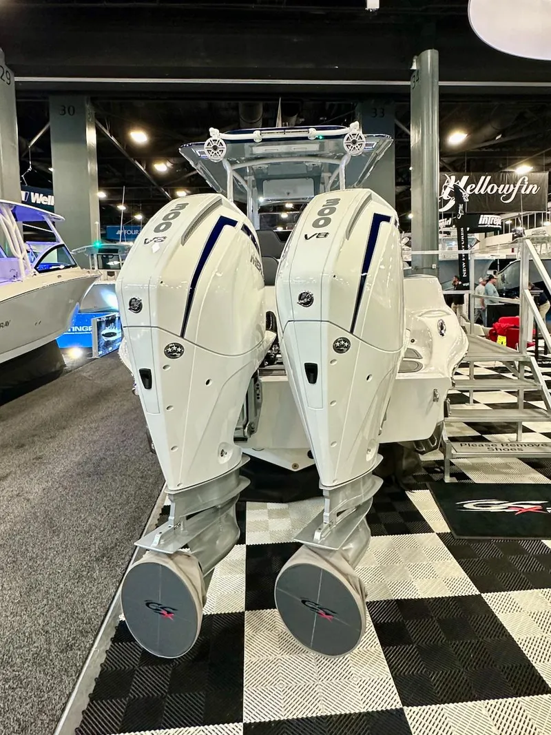 Slide: The Image of 2024 Glasstream 32 GSX boat with twin 600 V8 engines displayed indoors. - 3