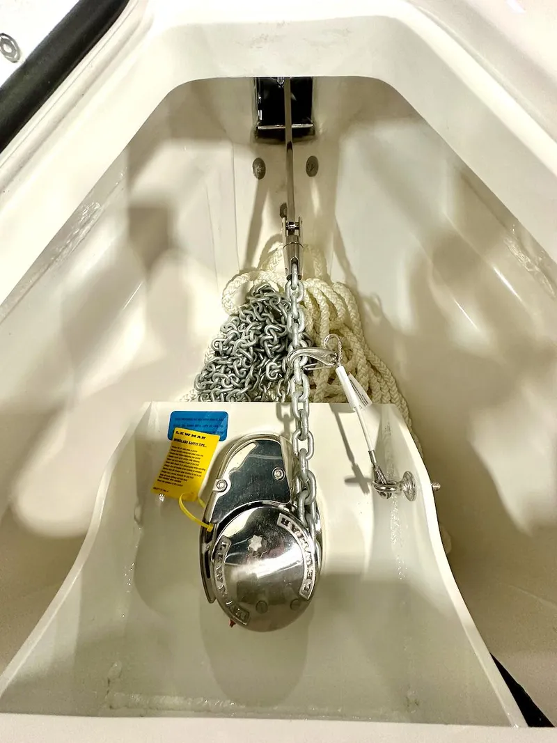 Slide: The Image of Anchor storage compartment of 2024 Glasstream 32 GSX boat with chain and rope. - 8