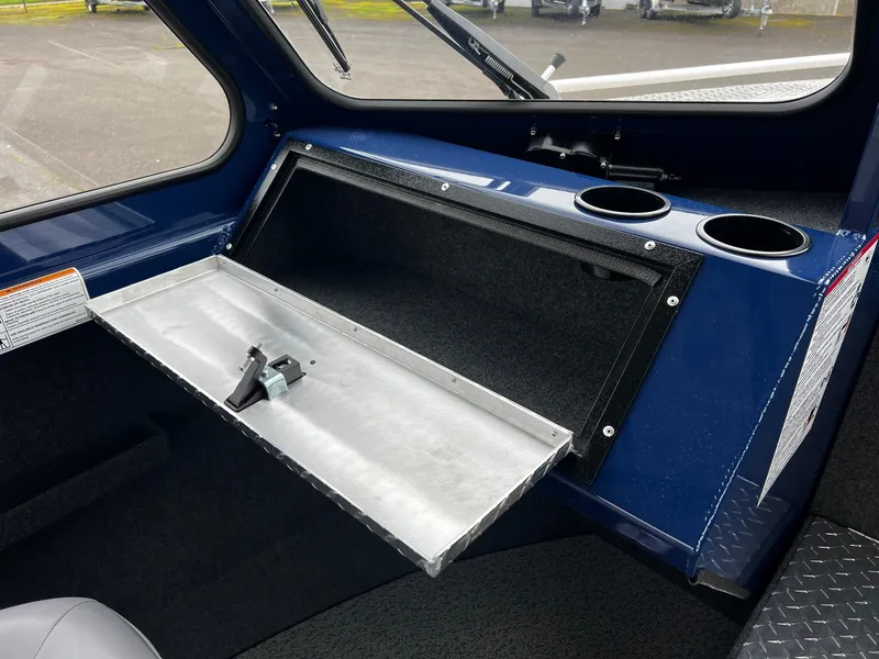 Slide: The Image of 2024 Thunder Jet 20 Chinook OS interior storage compartment with cup holders. - 11