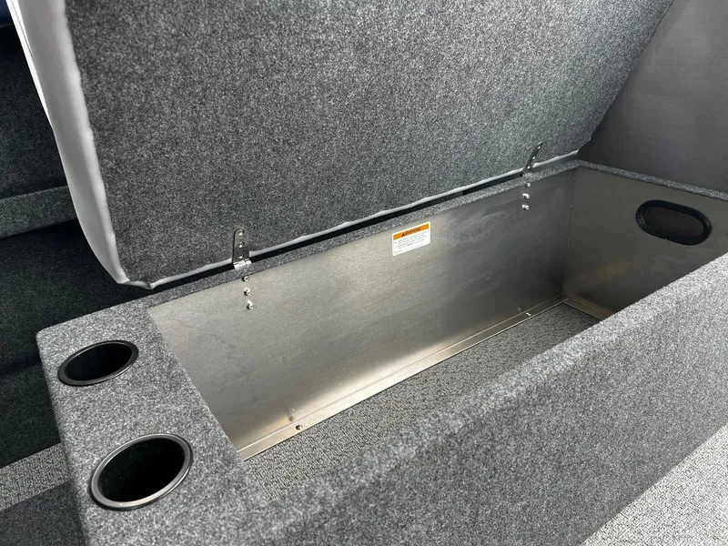 Slide: The Image of 2024 Thunder Jet 20 Chinook OS storage compartment with cup holders. - 13