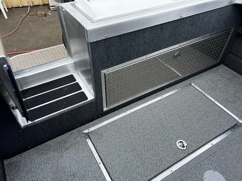 Slide: The Image of 2024 Thunder Jet 20 Chinook OS interior with storage compartments and non-slip flooring. - 16