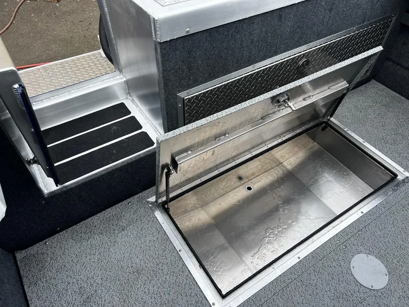 Slide: The Image of 2024 Thunder Jet 20 Chinook OS boat with open storage compartment. - 17