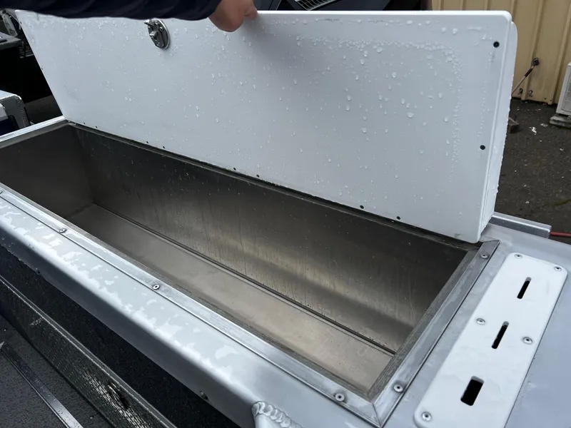 Slide: The Image of 2024 Thunder Jet 20 Chinook OS boat storage compartment with open lid. - 20
