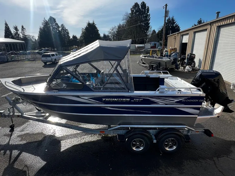 Slide: The Image of 2024 Thunder Jet 20 Chinook OS boat on trailer in outdoor lot. - 4