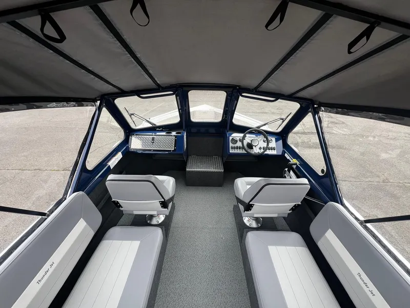 Slide: The Image of Interior of 2024 Thunder Jet 20 Chinook OS boat with seating and steering console. - 6