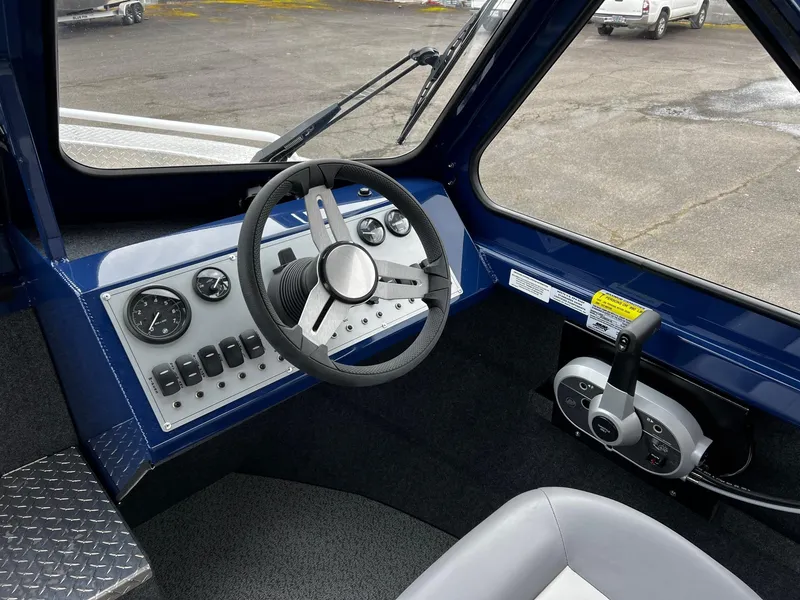 Slide: The Image of 2024 Thunder Jet 20 Chinook OS boat cockpit with steering wheel and control panel. - 8