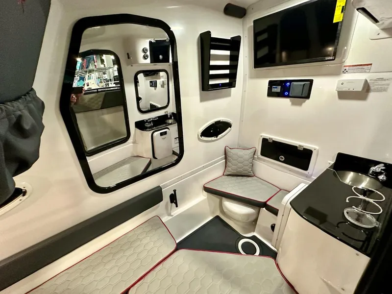 Slide: The Image of Interior cabin of 2024 Glasstream 36 GSX boat with seating, sink, and TV. - 11