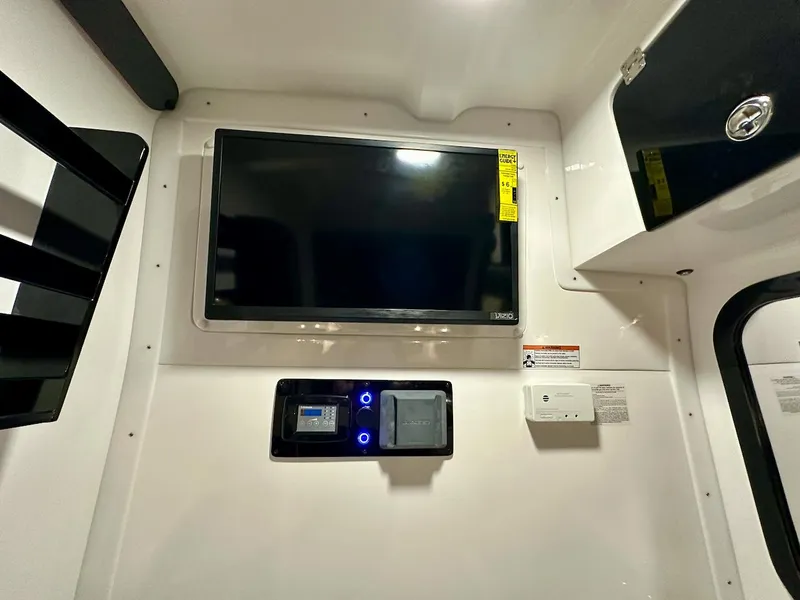 Slide: The Image of 2024 Glasstream 36 GSX interior with mounted TV and control panel. - 15