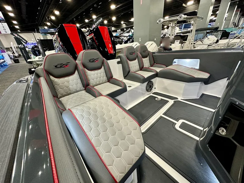 Slide: The Image of 2024 Glasstream 36 GSX boat interior with luxurious seating at a boat show. - 8
