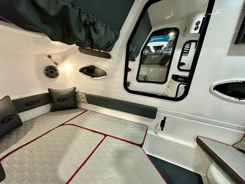 Slide: The Image of 2024 Glasstream 36 GSX cabin interior with modern seating and portholes. - 12