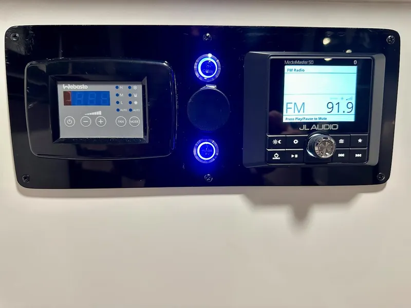 Slide: The Image of Control panel of the 2024 Glasstream 36 GSX boat featuring Webasto and JL Audio systems. - 16