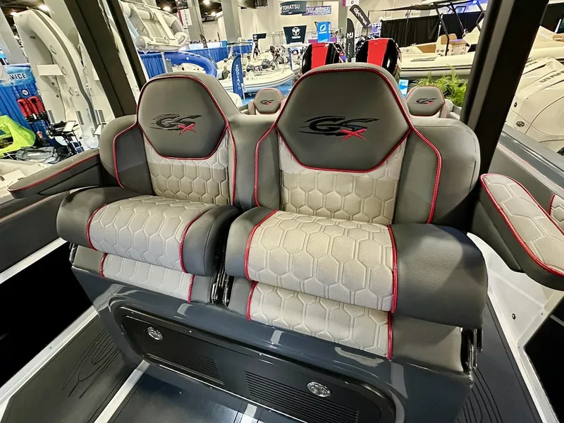 Slide: The Image of 2024 Glasstream 36 GSX boat seats with hexagonal pattern and red accents. - 4