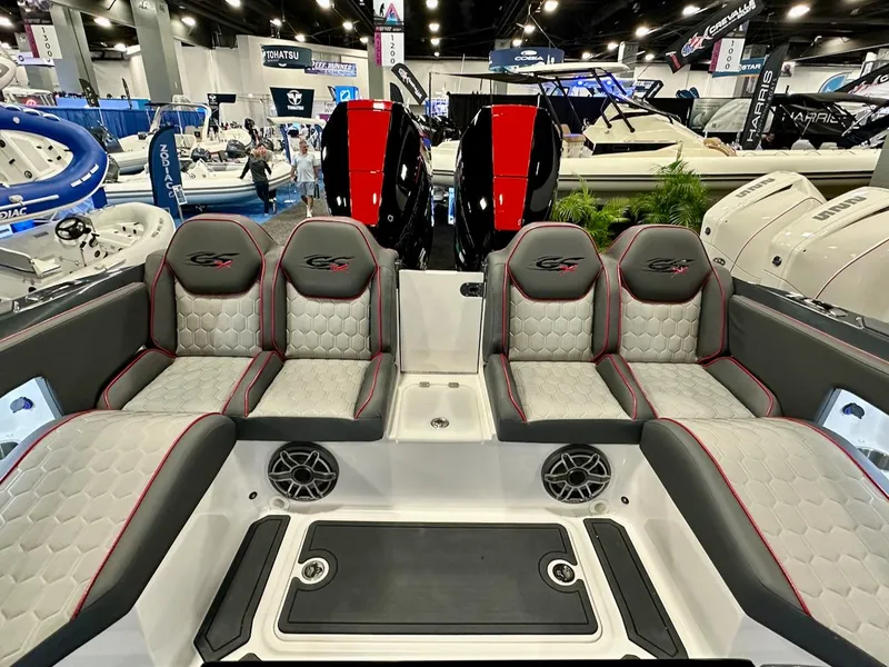 Slide: The Image of 2024 Glasstream 36 GSX boat interior at a boat show, featuring luxurious seating and twin outboard engines. - 7