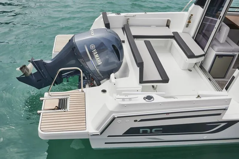 Slide: The Image of 2024 Jeanneau NC 795 Weekender S2 boat with Yamaha outboard motor on water. - 14