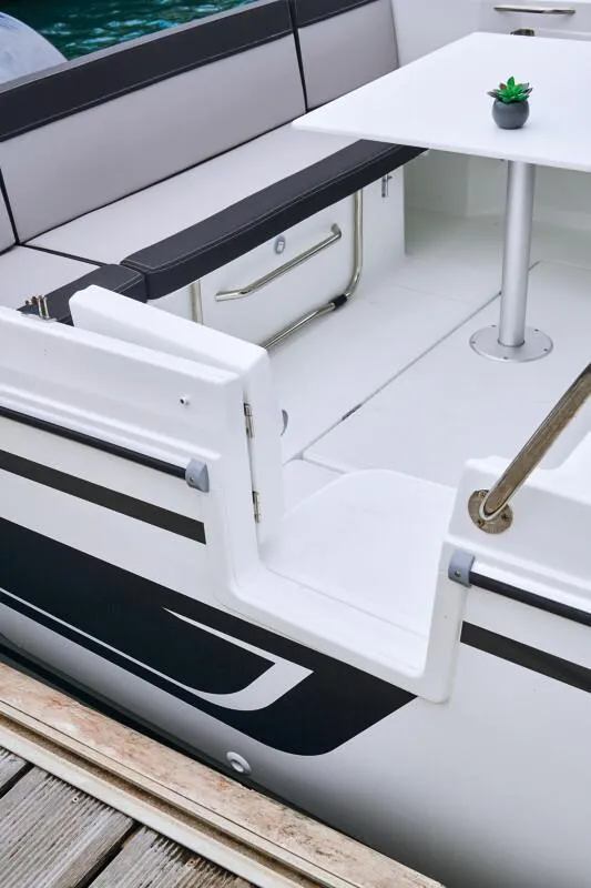 Slide: The Image of 2024 Jeanneau NC 795 Weekender S2 boat interior with seating and table. - 18