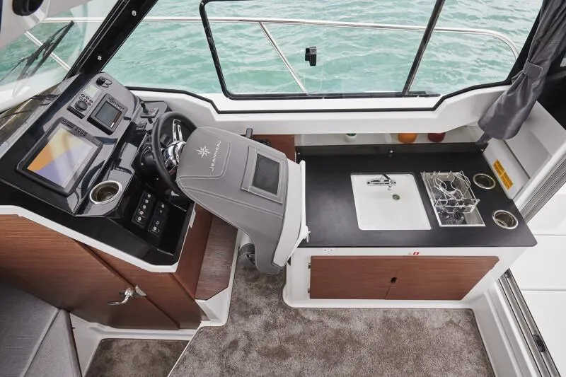 Slide: The Image of Interior of 2024 Jeanneau NC 795 Weekender S2 boat with helm and kitchenette. - 25