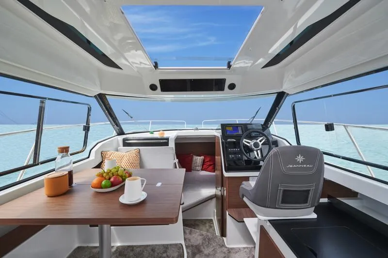 Slide: The Image of 2024 Jeanneau NC 795 Weekender S2 interior with dining table and helm station. - 38