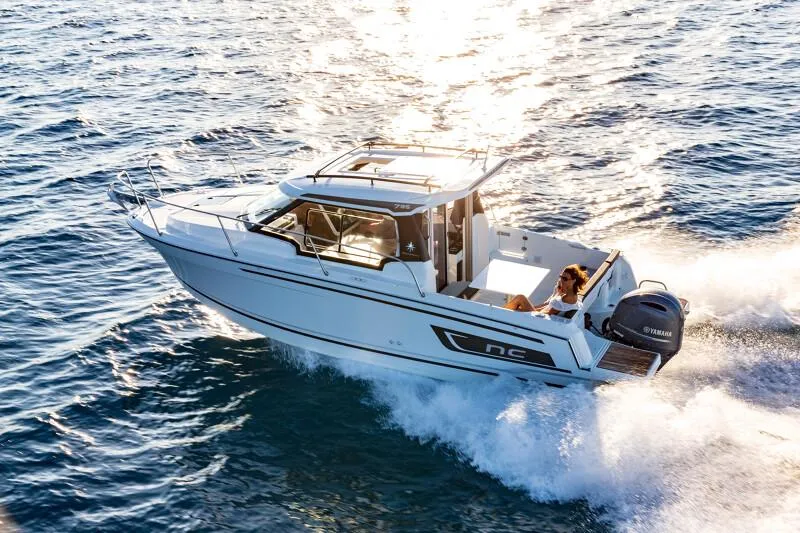 Slide: The Image of 2024 Jeanneau NC 795 Weekender S2 cruising on open water. - 9