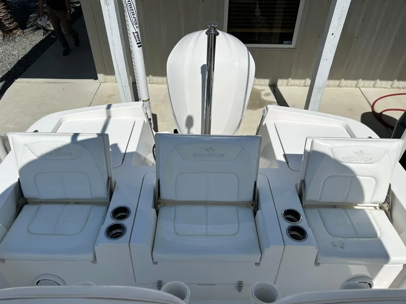 Slide: The Image of 2020 Regulator 26XO boat seating area with cup holders, viewed from above. - 15