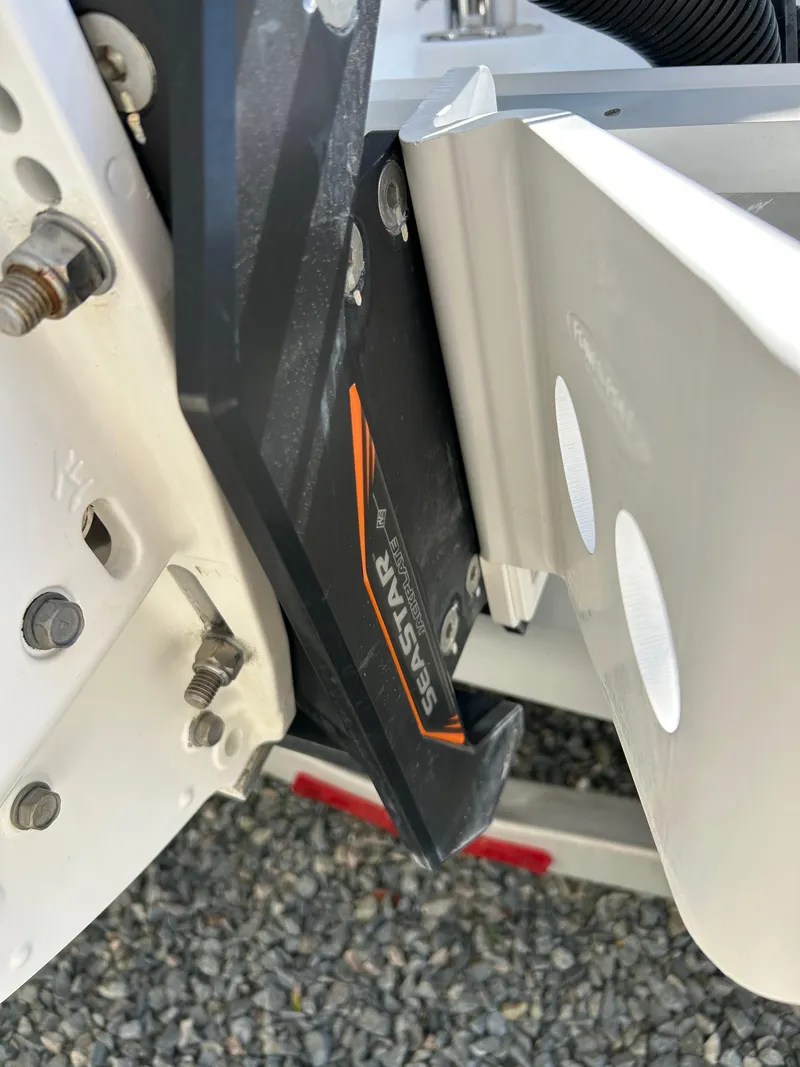 Slide: The Image of Close-up of a 2020 Regulator 26XO boat component with bolts and a bracket. - 21