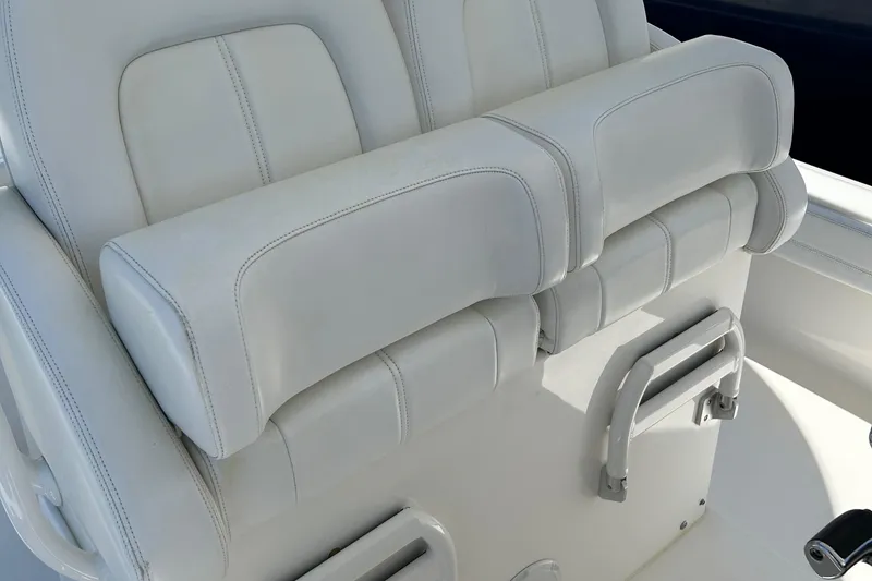 Slide: The Image of White leather seating on a 2020 Regulator 26XO boat. - 22