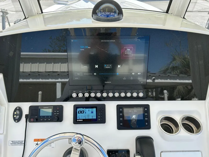 Slide: The Image of 2020 Regulator 26XO boat dashboard with modern navigation and control systems. - 26