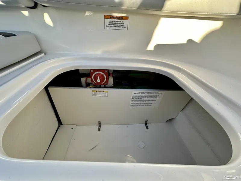 Slide: The Image of 2025 Bayliner M17 boat storage compartment with safety warning labels. - 11