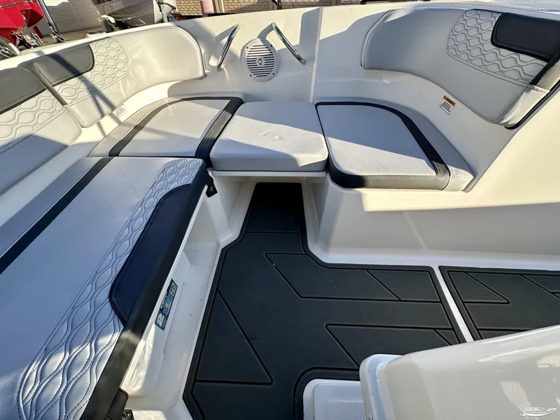 Slide: The Image of 2025 Bayliner M17 boat interior with cushioned seating and modern design. - 5