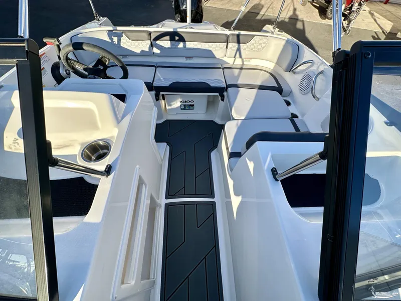 Slide: The Image of 2025 Bayliner M17 boat interior with modern seating and steering wheel. - 6