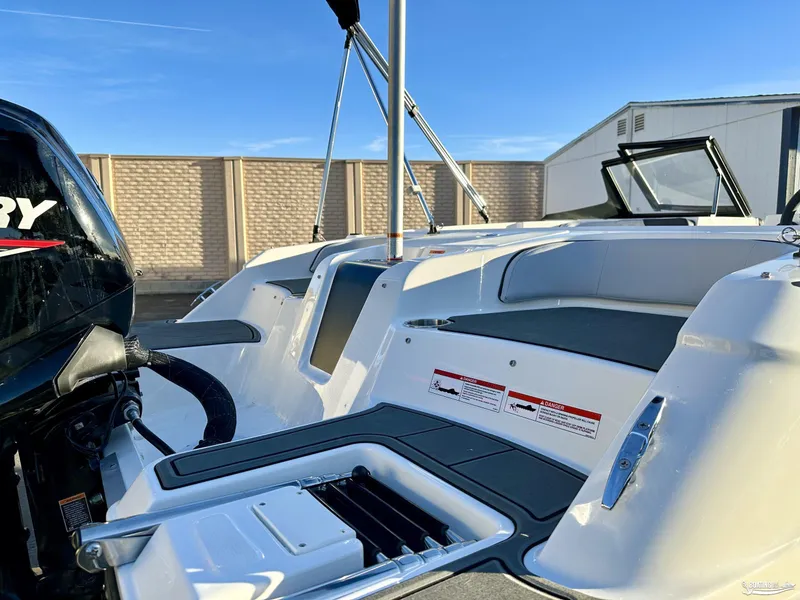 Slide: The Image of 2025 Bayliner M17 boat with Mercury engine, sleek design, and spacious seating. - 8