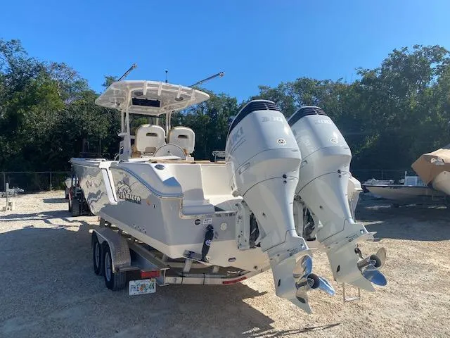 Slide: The Image of 2023 Sea Chaser 30 boat with dual outboard engines on a trailer. - 3