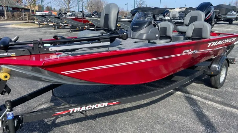 Slide: The Image of 2024 Tracker Pro 170 fishing boat in red on a trailer. - 2