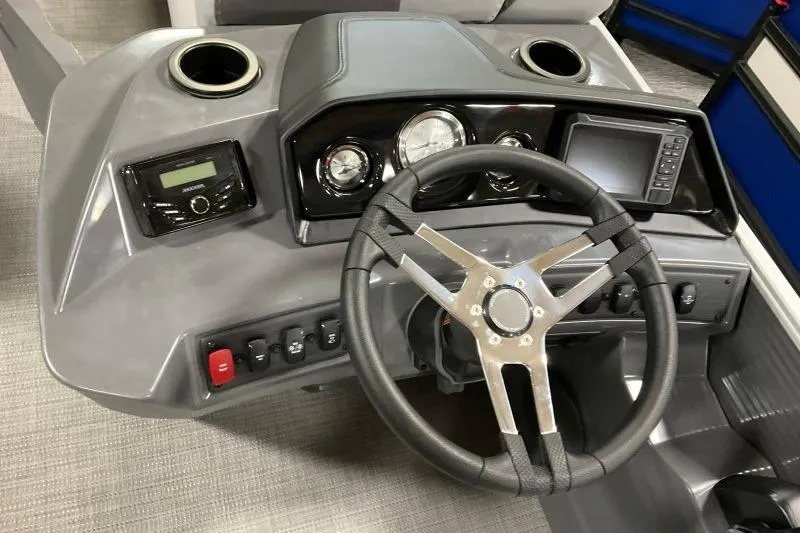 Slide: The Image of 2024 Bennington 22SVSR boat dashboard with steering wheel, gauges, and controls. - 4