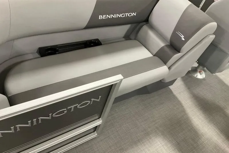 Slide: The Image of 2024 Bennington 22SVSR boat interior with gray seating and logo detailing. - 5