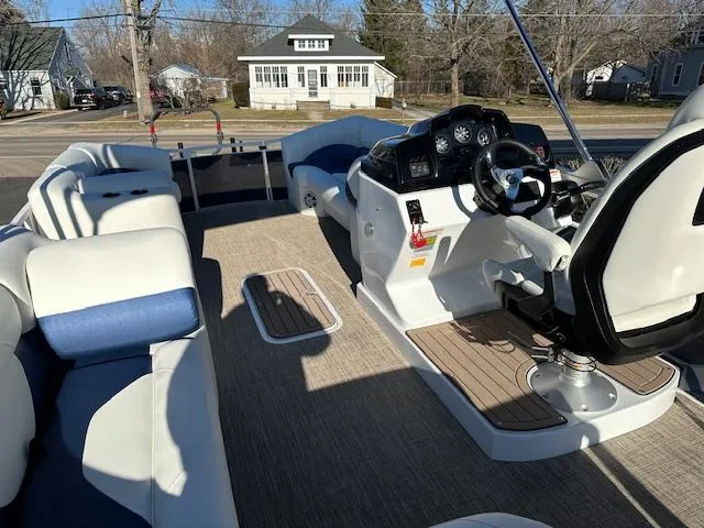 Slide: The Image of 2024 JC Spirit 221 TT Sport boat interior with modern seating and control console. - 3