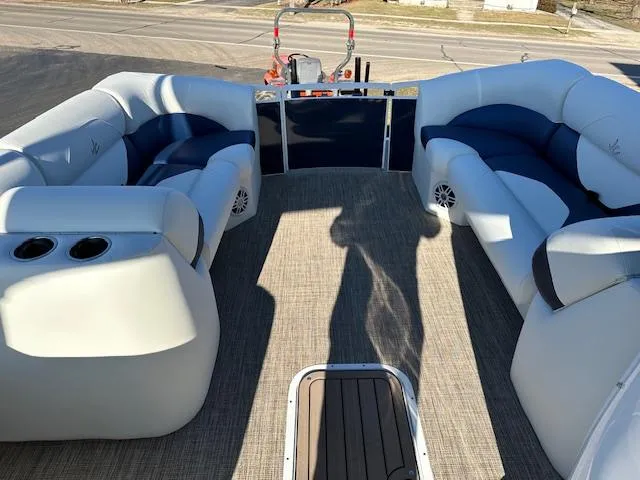 Slide: The Image of 2024 JC Spirit 221 TT Sport pontoon boat interior with plush seating and cup holders. - 8